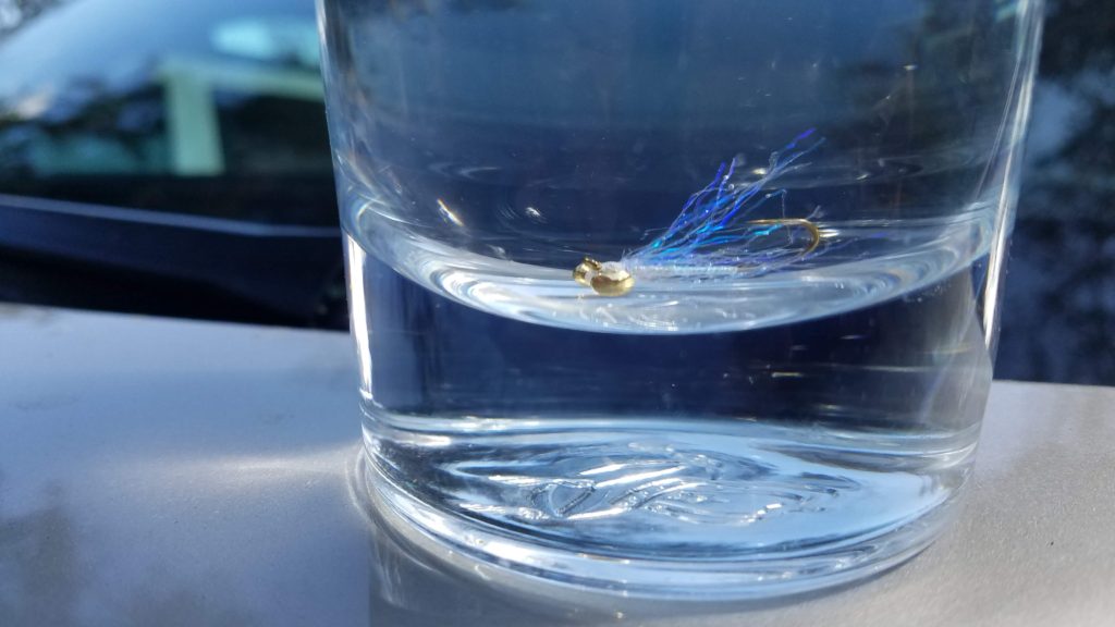 Electric Bugaloo Fly Pattern in a glass of water