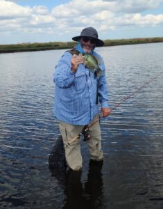 Ray with a Speck he caught on the fly on the St. Johns River